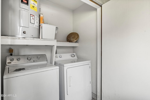 laundry area featuring washer and clothes dryer and water heater