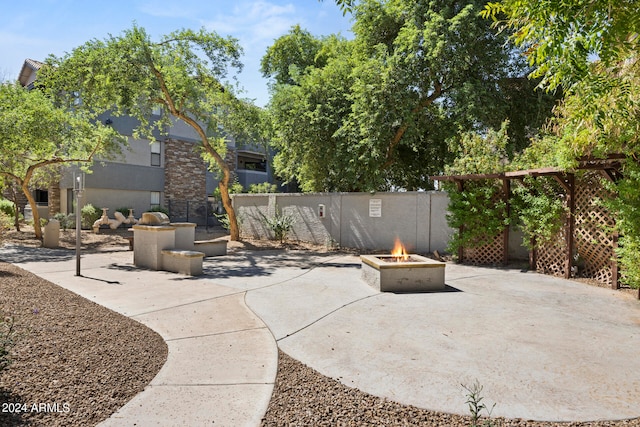 view of patio / terrace with an outdoor fire pit