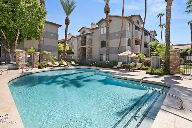 view of swimming pool with a patio area