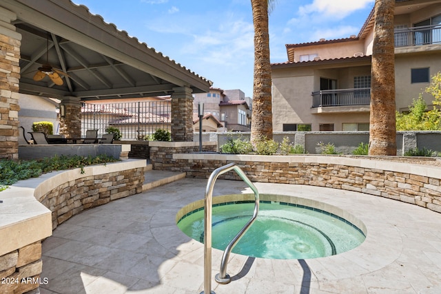 view of swimming pool with a gazebo, a hot tub, and a patio area