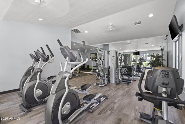 2025 E Campbell Ave Unit 260, Phoenix, AZ 85016 - exercise room with wood finished floors, recessed lighting, vaulted ceiling, and visible vents