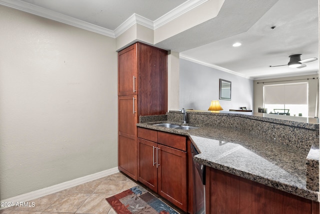 kitchen featuring ceiling fan, light tile patterned flooring, sink, dark stone counters, and crown molding