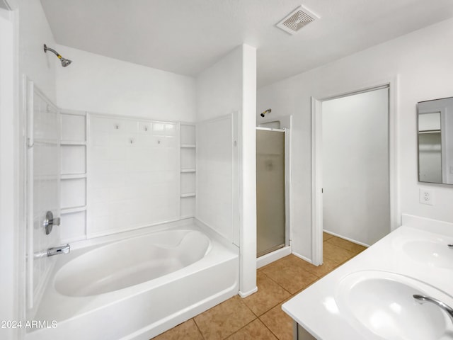 bathroom with shower / tub combination, vanity, and tile patterned floors