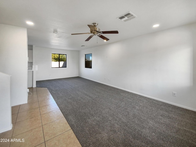 carpeted empty room with ceiling fan