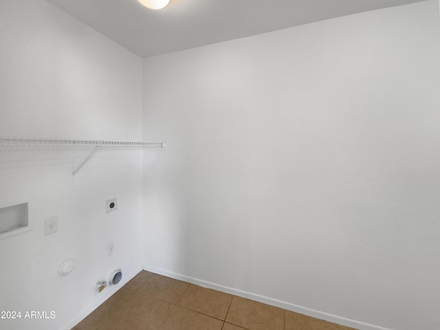 laundry area with tile patterned floors, electric dryer hookup, and hookup for a gas dryer