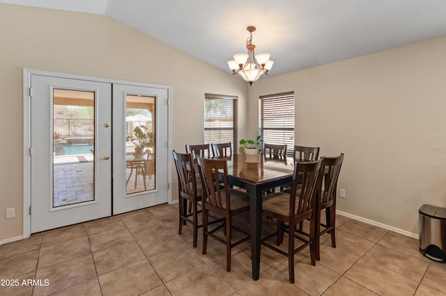 12712 W Milton Dr, Peoria, AZ 85383 - dining room with french doors, lofted ceiling, a chandelier, light tile patterned floors, and baseboards