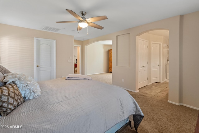 12712 W Milton Dr, Peoria, AZ 85383 - carpeted bedroom featuring arched walkways, baseboards, and ceiling fan