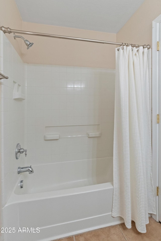 12712 W Milton Dr, Peoria, AZ 85383 - bathroom with shower / bathtub combination with curtain and tile patterned flooring