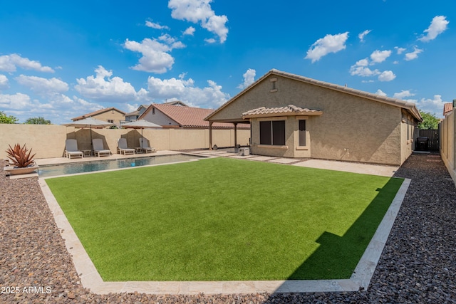 12712 W Milton Dr, Peoria, AZ 85383 - back of property featuring stucco siding, a patio area, and a tile roof