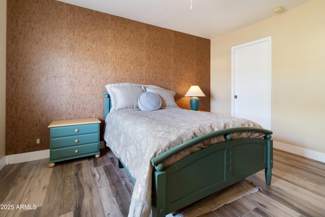 bedroom featuring wood-type flooring