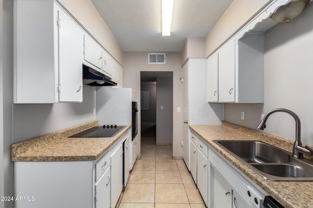 kitchen featuring light tile patterned floors, white cabinetry, black appliances, and sink