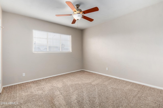 spare room with ceiling fan and carpet floors