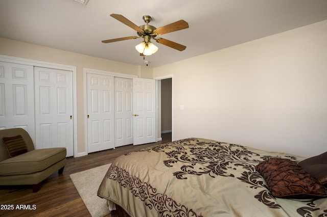 11447 E Mendoza Ave, Mesa, AZ 85209 - bedroom featuring wood finished floors, ceiling fan, and two closets