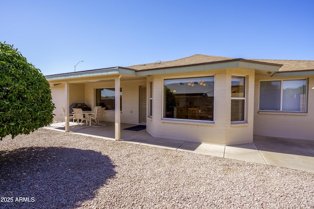 11447 E Mendoza Ave, Mesa, AZ 85209 - back of house with a shingled roof and a patio area