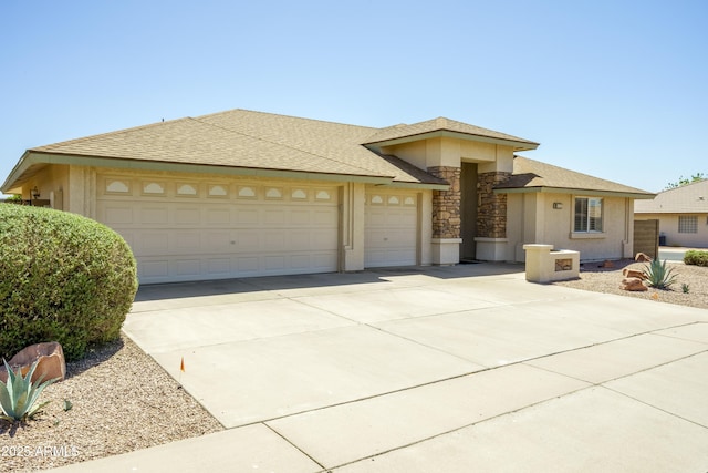 11447 E Mendoza Ave, Mesa, AZ 85209 - view of front facade featuring a garage, stucco siding, concrete driveway, and stone siding