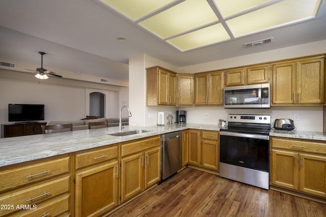 11447 E Mendoza Ave, Mesa, AZ 85209 - kitchen featuring visible vents, a sink, light stone countertops, and stainless steel appliances