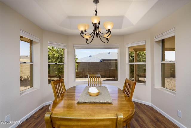 11447 E Mendoza Ave, Mesa, AZ 85209 - dining space with an inviting chandelier, baseboards, a tray ceiling, and dark wood finished floors