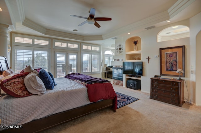 bedroom with access to exterior, crown molding, visible vents, and carpet floors