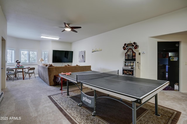 game room featuring light colored carpet and ceiling fan