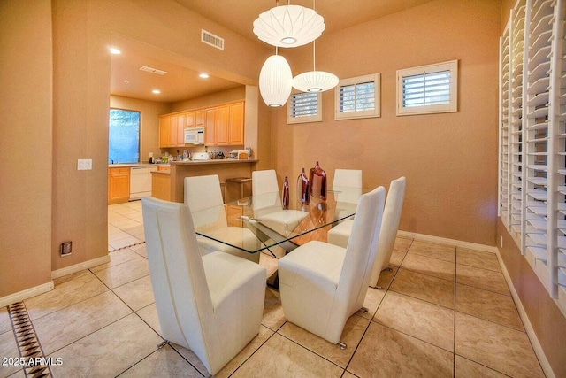 dining room featuring light tile patterned floors