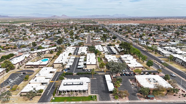 birds eye view of property with a mountain view