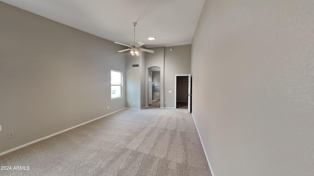 unfurnished room featuring light carpet and ceiling fan