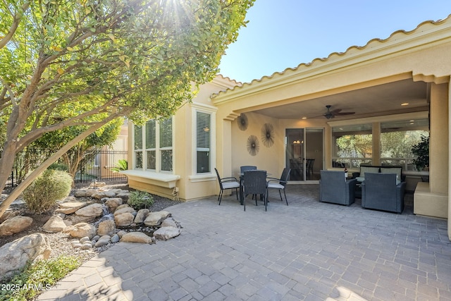 view of patio / terrace featuring ceiling fan