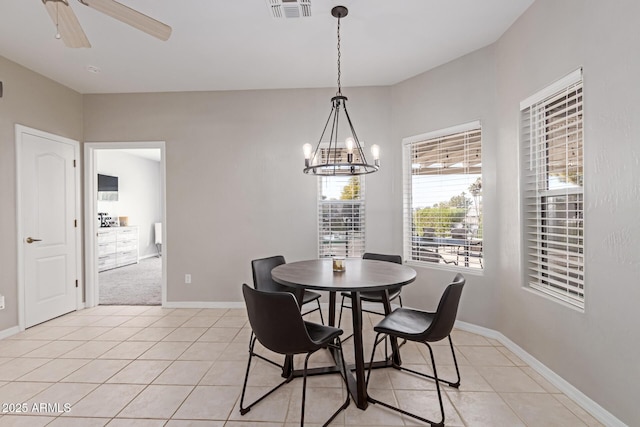 2714 N 63rd St, Mesa, AZ 85215 - tiled dining space with ceiling fan with notable chandelier