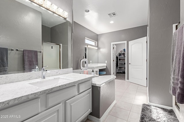2714 N 63rd St, Mesa, AZ 85215 - bathroom with vanity, a shower with door, and tile patterned floors