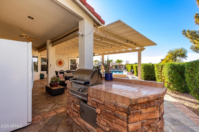 2714 N 63rd St, Mesa, AZ 85215 - view of patio / terrace featuring a pergola, exterior kitchen, ceiling fan, grilling area, and a fenced in pool