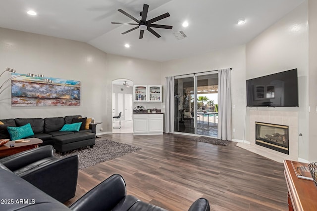2714 N 63rd St, Mesa, AZ 85215 - living room featuring a tile fireplace, high vaulted ceiling, dark hardwood / wood-style floors, and ceiling fan