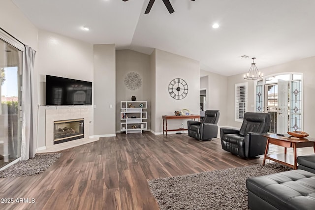 2714 N 63rd St, Mesa, AZ 85215 - living room featuring lofted ceiling, hardwood / wood-style floors, ceiling fan with notable chandelier, and a fireplace