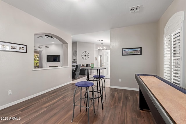 2714 N 63rd St, Mesa, AZ 85215 - rec room with dark wood-type flooring and ceiling fan with notable chandelier