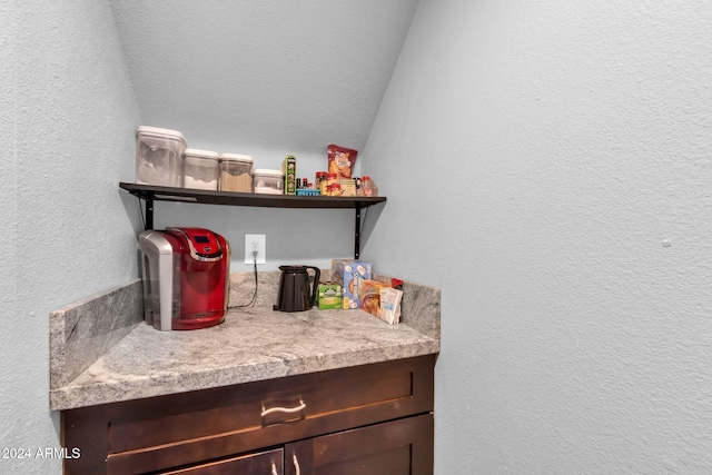 10847 E Forge Cir, Mesa, AZ 85208 - bar area featuring a textured wall and lofted ceiling