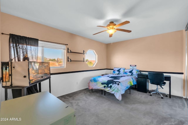 10847 E Forge Cir, Mesa, AZ 85208 - carpeted bedroom with a desk and ceiling fan