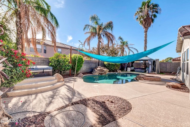 10847 E Forge Cir, Mesa, AZ 85208 - view of swimming pool with a covered hot tub, a fenced backyard, a patio area, and a gazebo