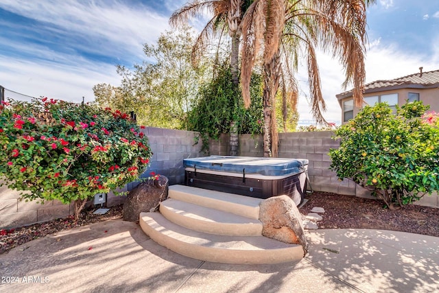 10847 E Forge Cir, Mesa, AZ 85208 - fenced backyard featuring a hot tub and a patio area