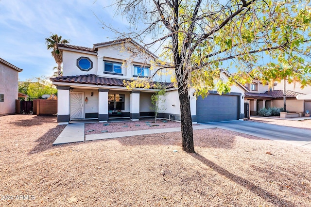 10847 E Forge Cir, Mesa, AZ 85208 - view of front of home with stucco siding, a tiled roof, concrete driveway, and covered porch