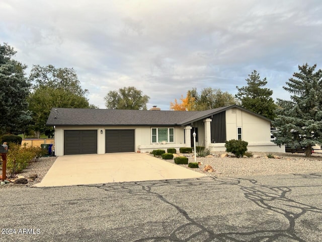 single story home featuring a garage