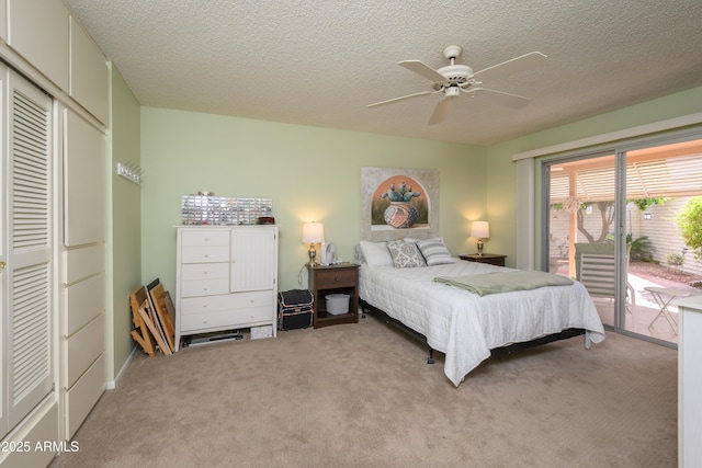 bedroom with light carpet, a ceiling fan, access to outside, a textured ceiling, and a closet