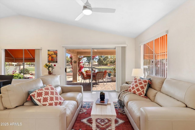 living room with lofted ceiling and ceiling fan