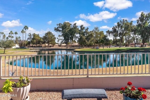 view of pool featuring a water view