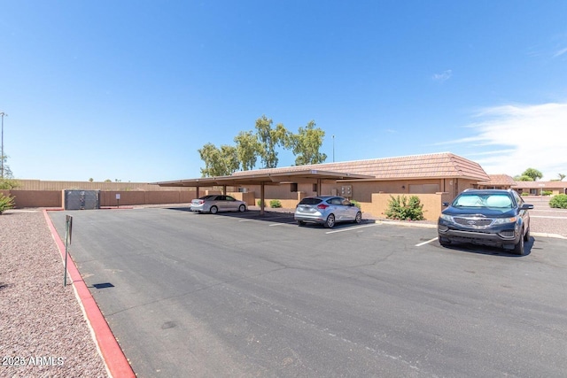 view of vehicle parking with a carport