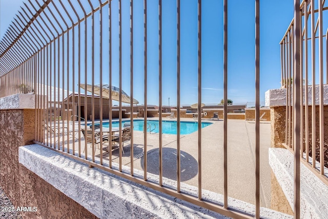 view of swimming pool featuring a patio