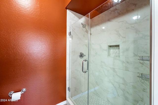 bathroom featuring an enclosed shower