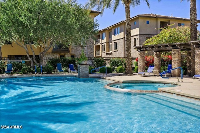 view of swimming pool featuring a community hot tub