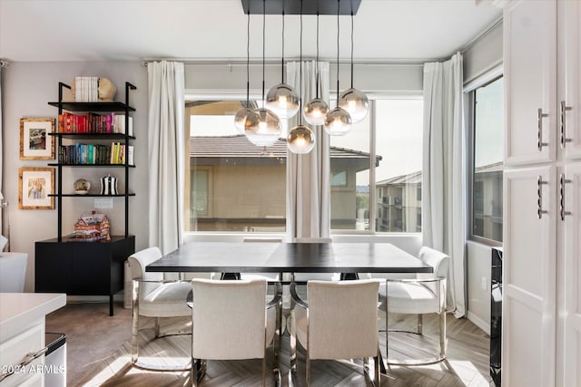 dining space with parquet floors