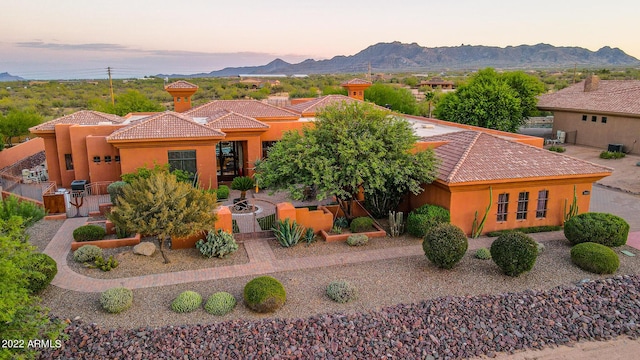 view of front of home featuring a mountain view