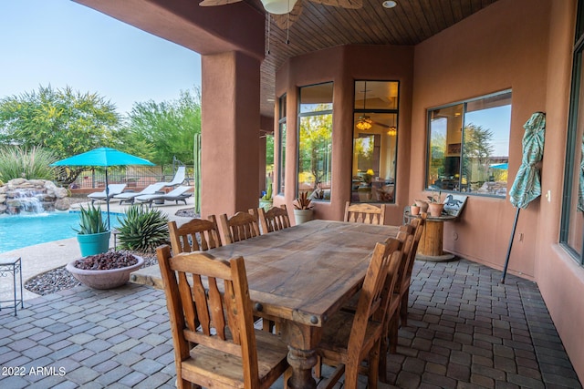 view of patio / terrace with pool water feature and ceiling fan