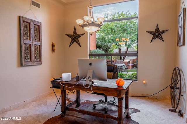 office space featuring an inviting chandelier and plenty of natural light